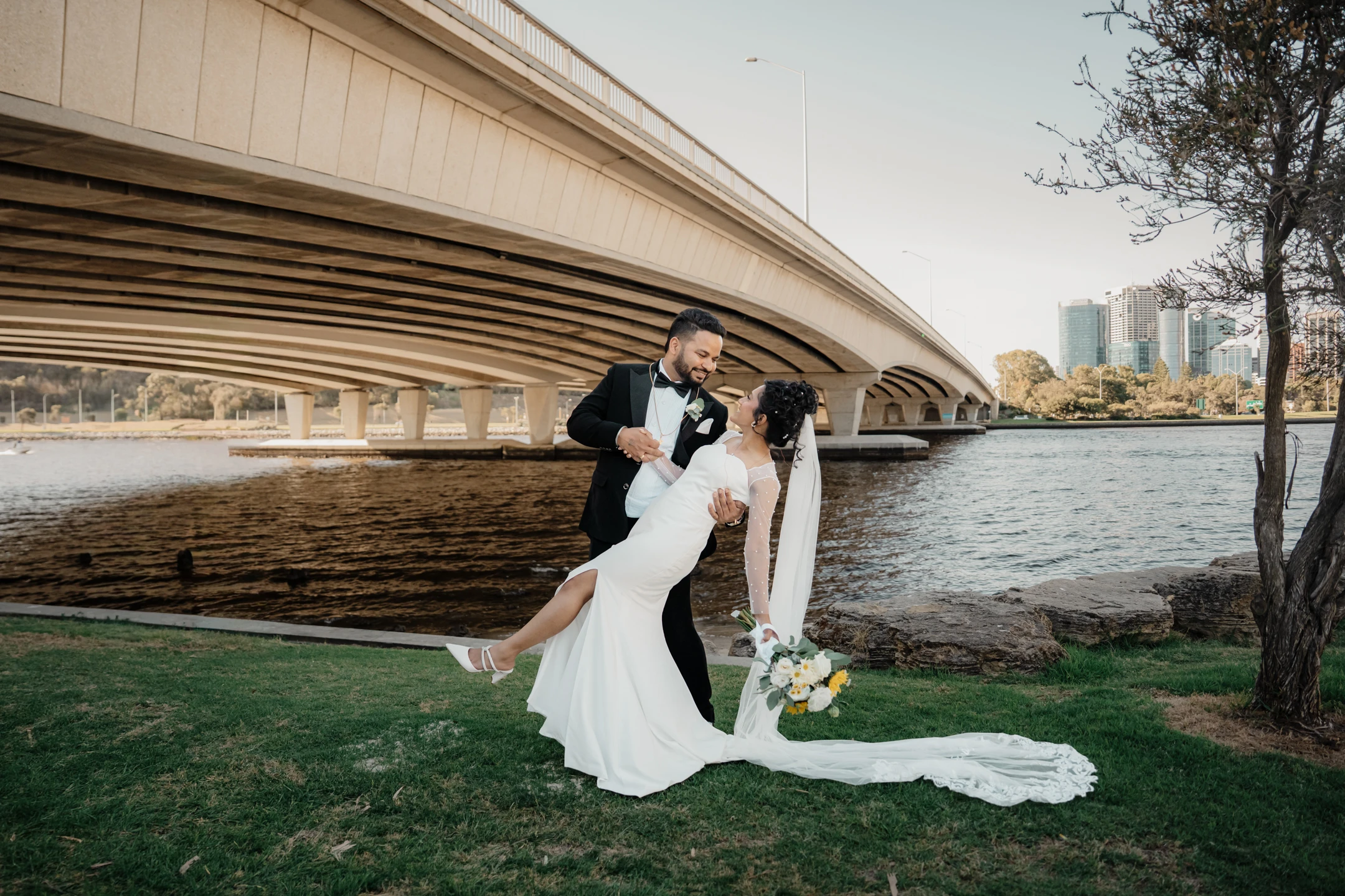 Home 19 Marrygold Weddings #1 Wedding photography and videography in Perth indian bride groom dip pose riverside bridge Marrygold Weddings #1 Wedding photography and videography in Perth