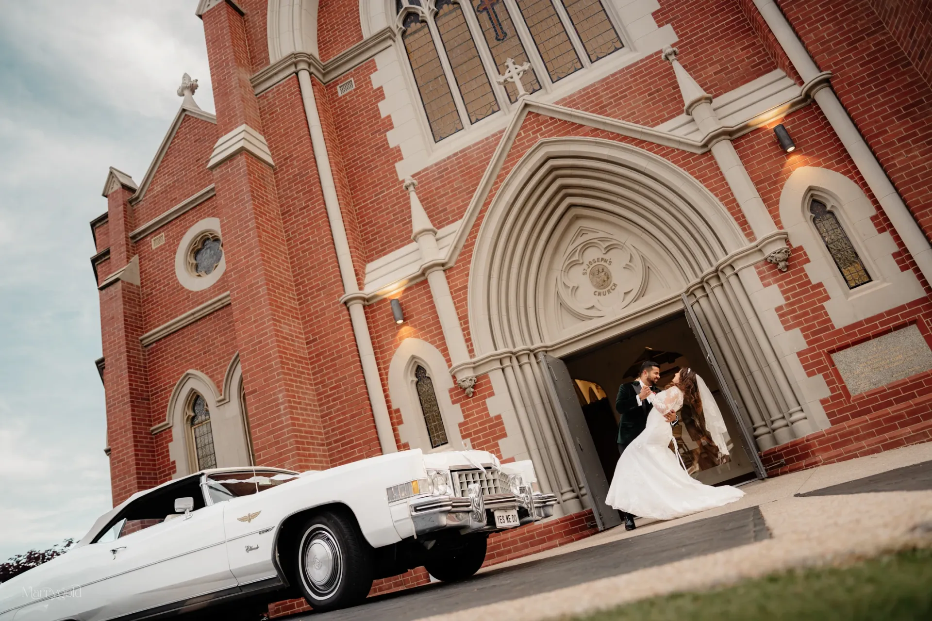 bride groom church doorway white vintage convertible wedding Marrygold Weddings #1 Wedding photography and videography in Perth